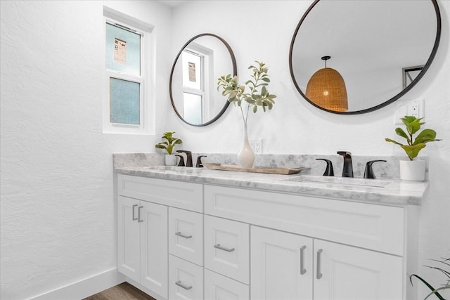 bathroom featuring vanity and hardwood / wood-style floors