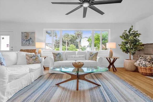 living room featuring ceiling fan and wood-type flooring