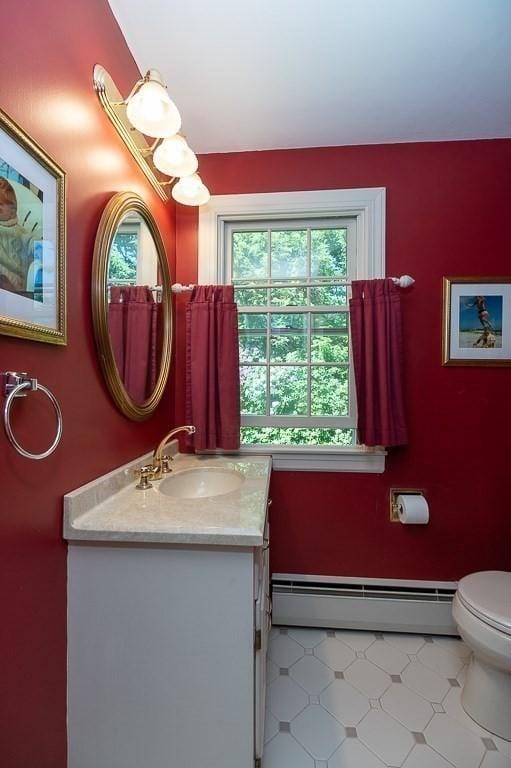 3 Tally Ho Dr, Hamilton, MA 01982 - bathroom with baseboard heating, vanity, plenty of natural light, and toilet