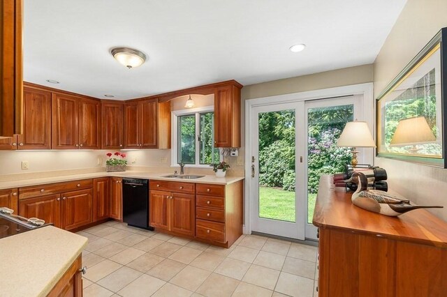3 Tally Ho Dr, Hamilton, MA 01982 - kitchen with black dishwasher, a sink, light countertops, and light tile patterned flooring