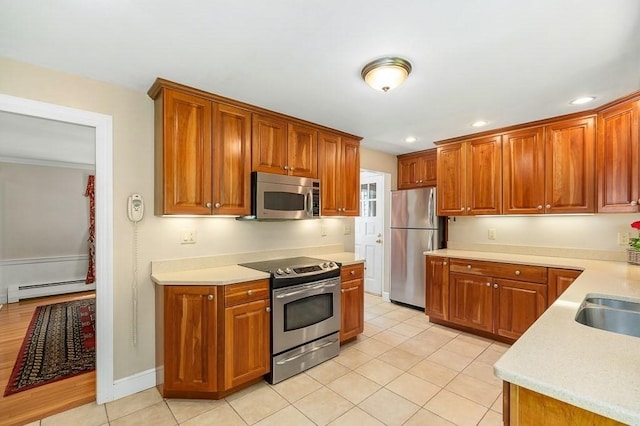 3 Tally Ho Dr, Hamilton, MA 01982 - kitchen with appliances with stainless steel finishes, light countertops, baseboard heating, light tile patterned flooring, and recessed lighting