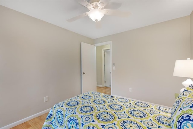 bedroom featuring light wood-type flooring and ceiling fan