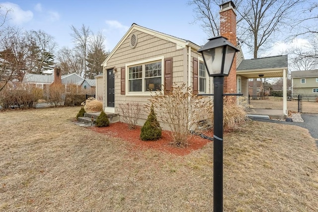 view of side of property with a yard