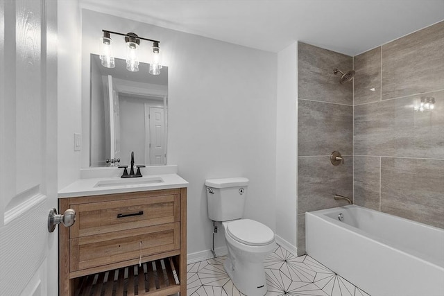 bathroom featuring baseboards, vanity, tile patterned floors, toilet, and washtub / shower combination