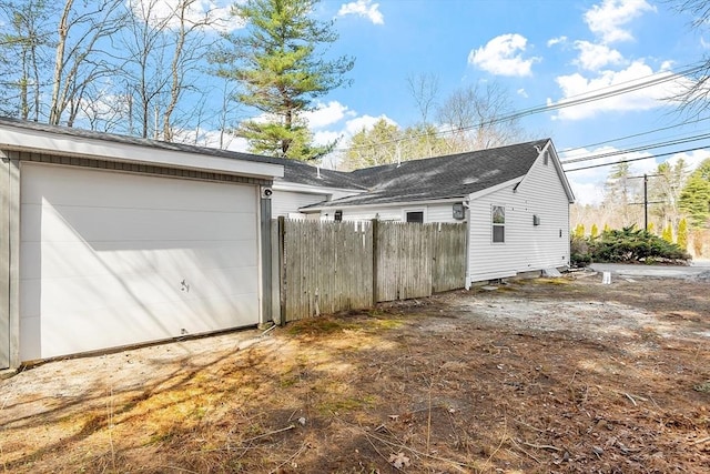 garage featuring fence