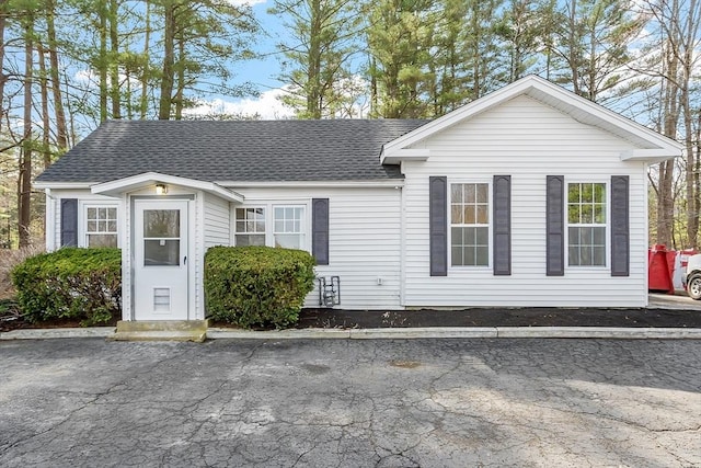 view of front of house with roof with shingles
