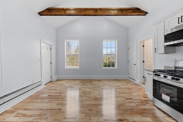 kitchen featuring light wood-type flooring, vaulted ceiling with beams, white cabinetry, a baseboard heating unit, and appliances with stainless steel finishes