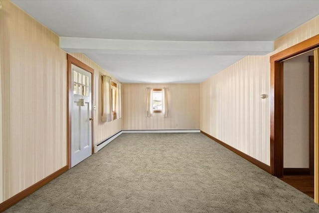 unfurnished room with baseboards and carpet flooring