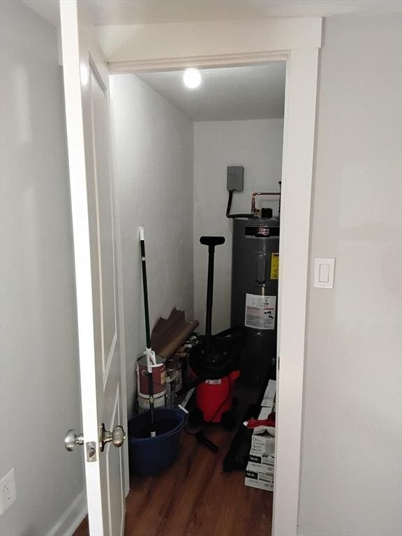 hall featuring water heater and wood finished floors