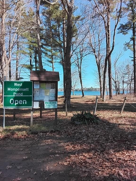 surrounding community with a water view