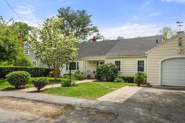 39 Manton Rd, Swampscott, MA 01907 - view of front of house featuring driveway, a front lawn, a chimney, an attached garage, and roof with shingles