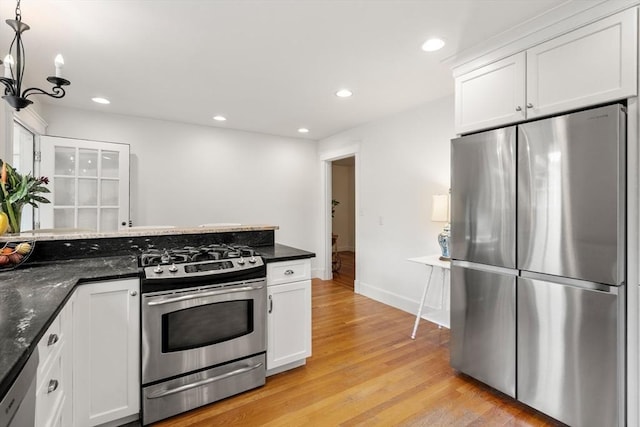 39 Manton Rd, Swampscott, MA 01907 - kitchen with stainless steel appliances, light wood-style floors, white cabinetry, baseboards, and recessed lighting