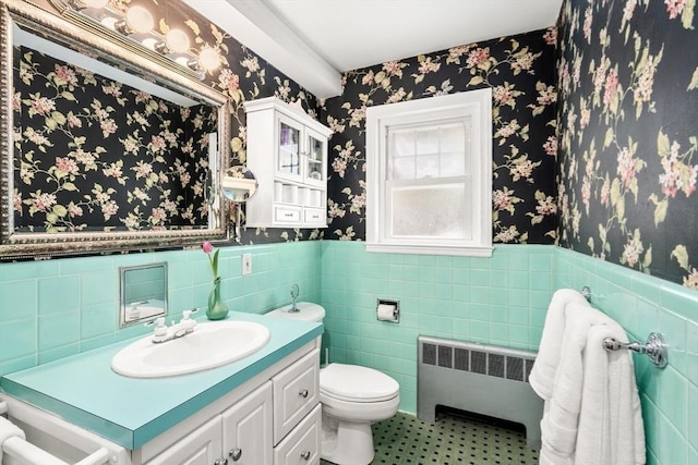 39 Manton Rd, Swampscott, MA 01907 - bathroom with wallpapered walls, a wainscoted wall, vanity, toilet, and radiator heating unit
