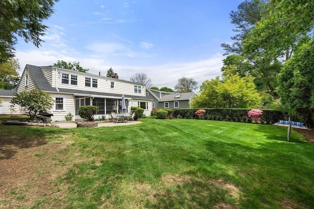 39 Manton Rd, Swampscott, MA 01907 - rear view of property with a chimney, a lawn, a sunroom, a patio area, and a shingled roof