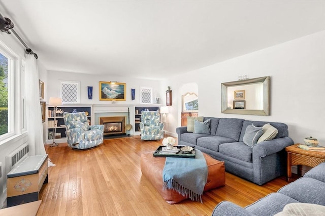 39 Manton Rd, Swampscott, MA 01907 - living area featuring wood finished floors and a fireplace with flush hearth