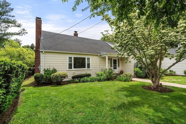 39 Manton Rd, Swampscott, MA 01907 - view of front of home with a chimney, a front yard, and roof with shingles