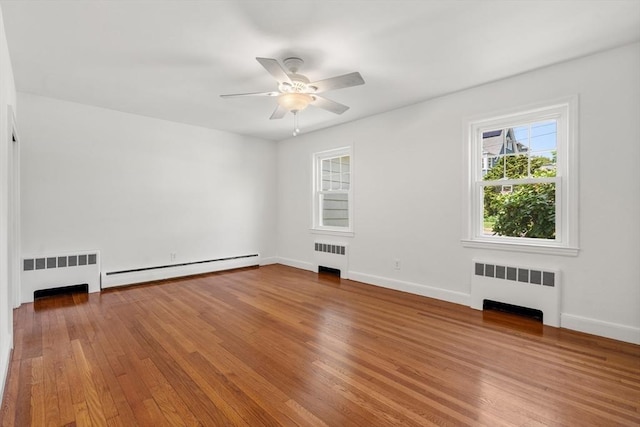 39 Manton Rd, Swampscott, MA 01907 - spare room featuring radiator, a baseboard radiator, a ceiling fan, and hardwood / wood-style floors
