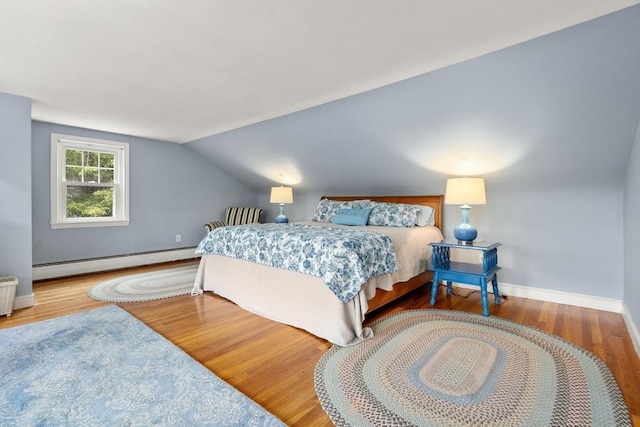 39 Manton Rd, Swampscott, MA 01907 - bedroom featuring a baseboard heating unit, wood finished floors, lofted ceiling, and baseboards