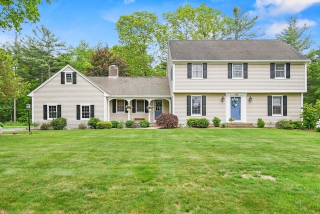 188 Munger Hill Rd, Westfield, MA 01085 - colonial inspired home with a front yard and a chimney