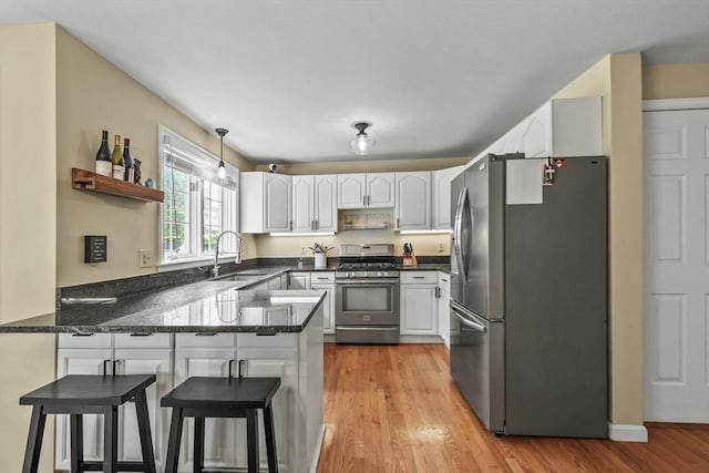 188 Munger Hill Rd, Westfield, MA 01085 - kitchen with appliances with stainless steel finishes, a sink, a peninsula, and white cabinets
