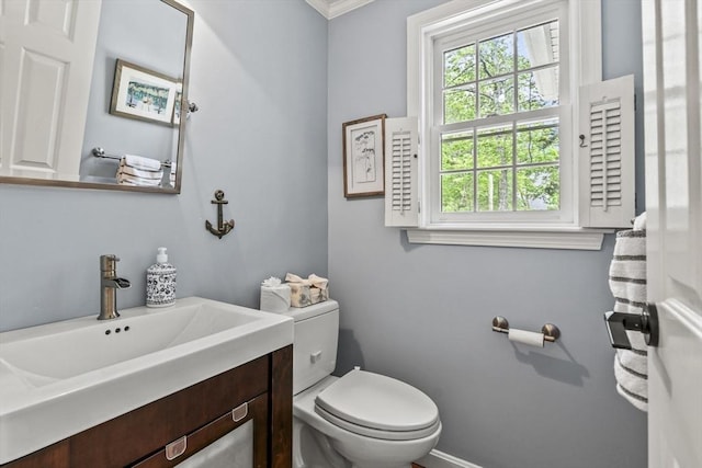 188 Munger Hill Rd, Westfield, MA 01085 - half bathroom with toilet, baseboards, crown molding, and vanity