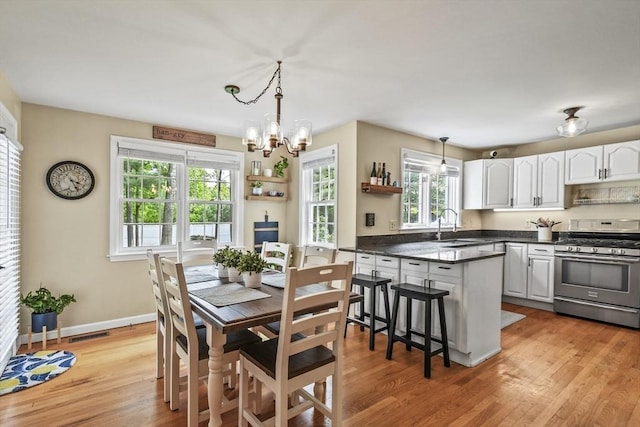 188 Munger Hill Rd, Westfield, MA 01085 - dining area featuring a chandelier, light wood finished floors, and baseboards