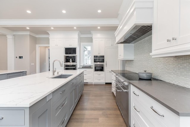 8 Hidden Rd, Weston, MA 02493 - kitchen with a sink, gray cabinets, custom exhaust hood, a kitchen island with sink, and stainless steel appliances