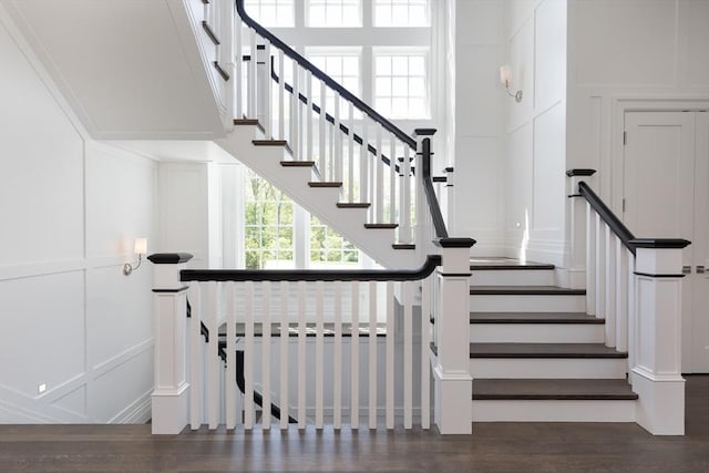 8 Hidden Rd, Weston, MA 02493 - staircase featuring a decorative wall and wood finished floors