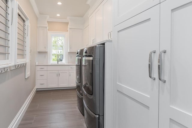8 Hidden Rd, Weston, MA 02493 - laundry room with washing machine and clothes dryer, recessed lighting, baseboards, cabinet space, and ornamental molding