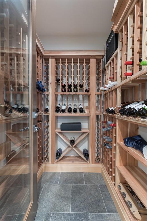 8 Hidden Rd, Weston, MA 02493 - wine room featuring stone tile floors