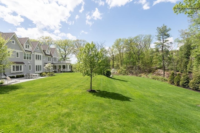 8 Hidden Rd, Weston, MA 02493 - view of grassy yard featuring a patio