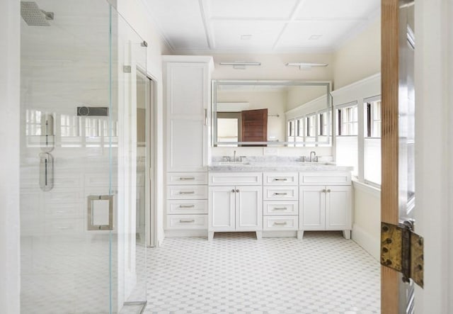 bathroom with vanity and a shower with shower door