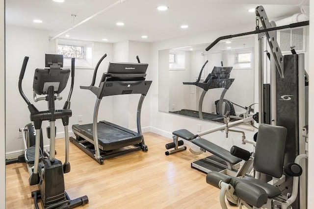 workout room with wood-type flooring