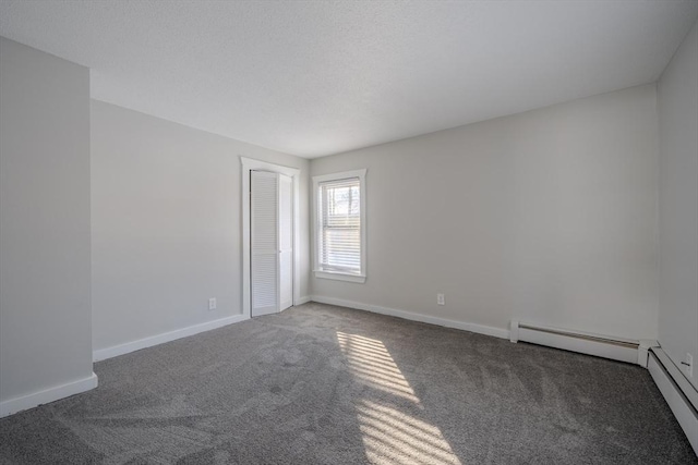 empty room with dark colored carpet