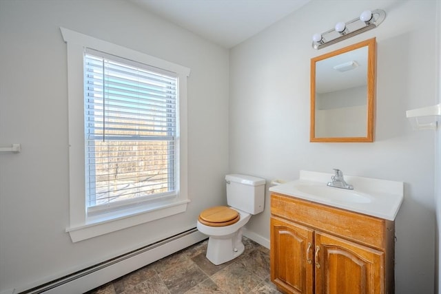 bathroom with vanity, a baseboard radiator, and toilet