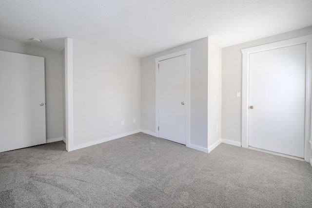 unfurnished bedroom with light colored carpet