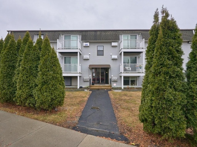 view of property with aphalt driveway