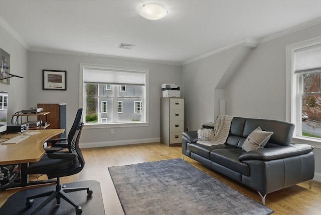 office featuring baseboards, ornamental molding, and light wood-type flooring