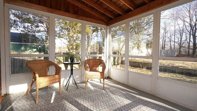 sunroom / solarium featuring wooden ceiling and vaulted ceiling