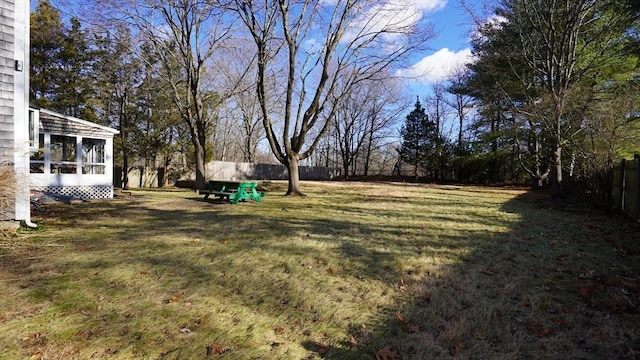 view of yard with a sunroom