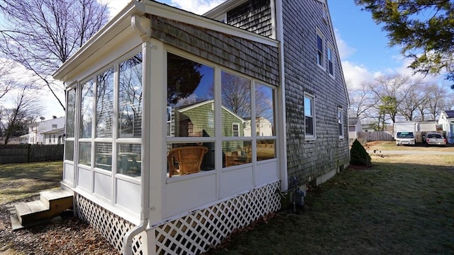 view of home's exterior featuring a sunroom