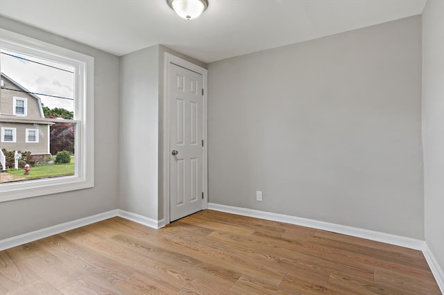 spare room featuring light wood-type flooring