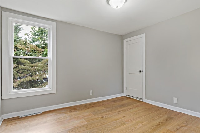 unfurnished room featuring light hardwood / wood-style floors