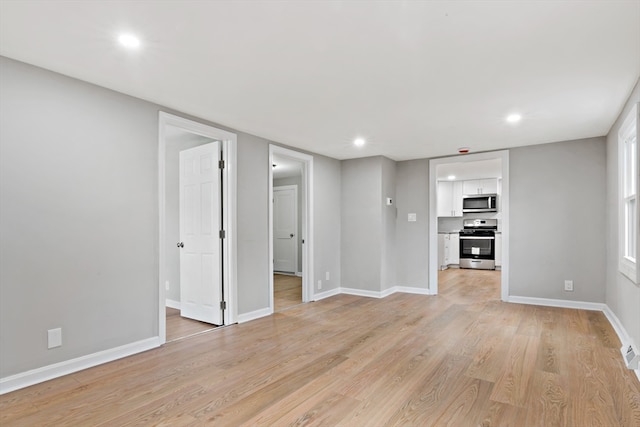 unfurnished living room featuring light wood-type flooring