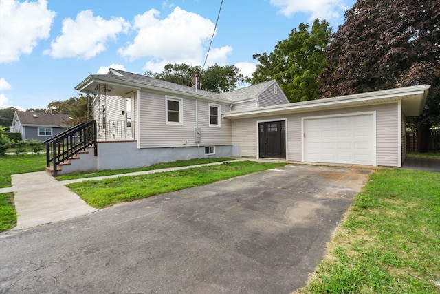 view of front facade with a garage and a front yard