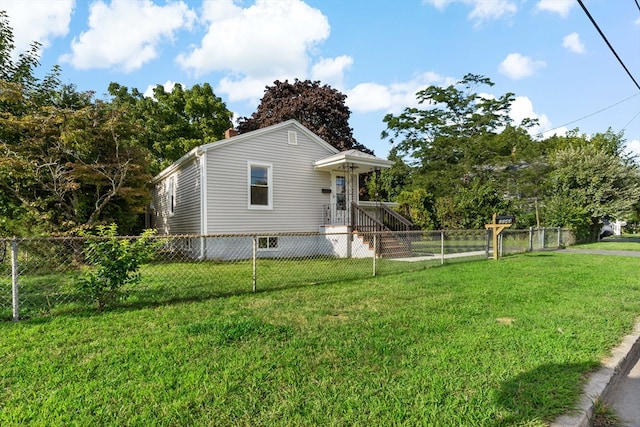 view of property exterior with a yard