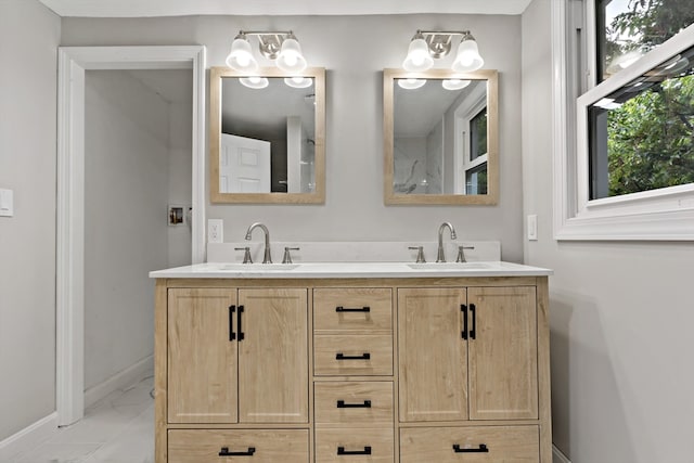 bathroom with vanity and a notable chandelier