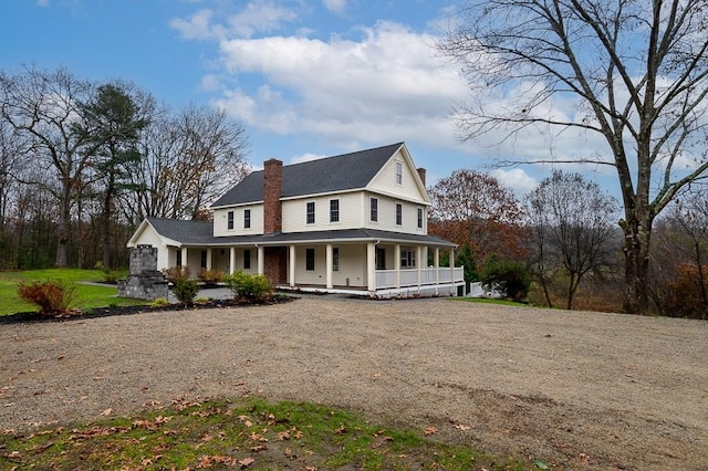 853 Oxford St S, Auburn, MA 01501 - farmhouse featuring covered porch, dirt driveway, a chimney, and roof with shingles