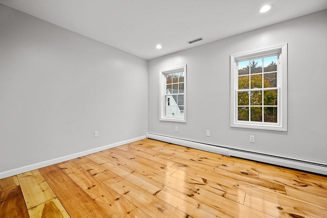 853 Oxford St S, Auburn, MA 01501 - unfurnished room with a baseboard heating unit, hardwood / wood-style flooring, baseboards, healthy amount of natural light, and recessed lighting