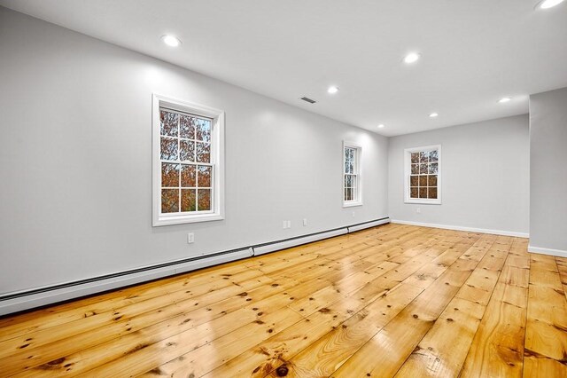 853 Oxford St S, Auburn, MA 01501 - unfurnished room featuring recessed lighting, a baseboard radiator, baseboards, plenty of natural light, and wood finished floors